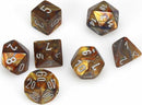 A shiny Lustrous Gold/Silver Polyhedral Dice Set by Chessex, consisting of seven uniquely shaped dice including d4, d6, d8, d10, d12, and d20, each showcasing marbled colors and clear numbering for easy visibility.