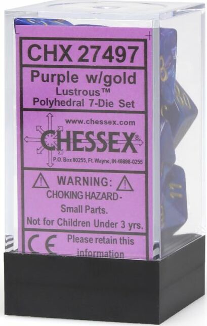 A set of lustrous purple and gold polyhedral dice displayed in a clear plastic box. The dice feature a vibrant purple base with shiny gold numbers. The packaging includes a label indicating the product as a 7-die set made by Chessex, along with a warning about small parts.