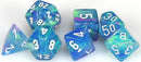 A collection of colorful polyhedral dice in shades of blue and green, featuring white numbers. The set includes various shapes like a d20, d12, and d10, perfect for tabletop games.
