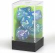 Festive Waterlily game set by Chessex featuring vibrant blue and purple dice with clear numbering. Comes in a clear protective case with a green background.