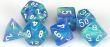 A vibrant set of polyhedral dice featuring a festive waterlily design with white details, made by Chessex. The dice are in shades of blue and include various shapes such as a d4, d6, d8, d10, d12, and d20, perfect for tabletop and role-playing games.