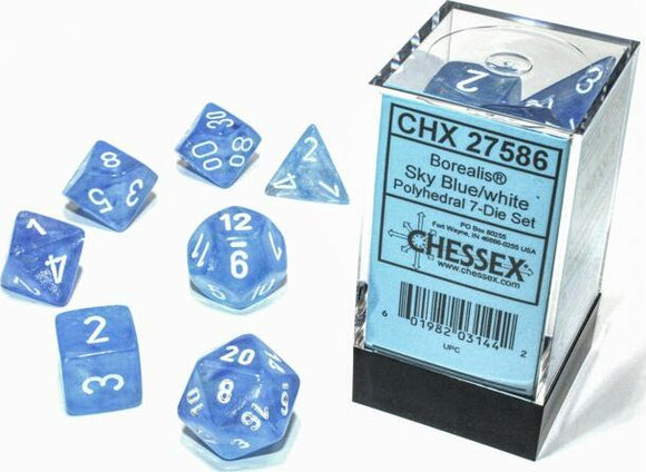 A set of Borealis Sky blue and white polyhedral dice, packaged in a clear plastic box. The 7-die set includes various shapes, such as a dodecahedron and tetrahedron, showing white numbers against a blue background, ideal for tabletop gaming and role-playing games.