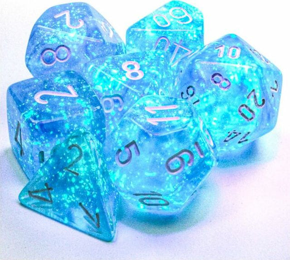 Set of Borealis Sky blu/wht Lumin Polyhedral dice made by Chessex. The dice feature a translucent blue color with sparkling flecks. They include various shapes like a tetrahedron, cube, and dodecahedron, each with clear numbers in a contrasting color. Perfect for tabletop RPGs and gaming.