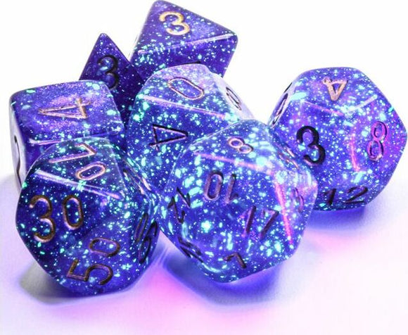 A Borealis Luminary Royal Purple and Gold Polyhedral Dice Set by Chessex, featuring a stunning galaxy-inspired design with deep purple and gold colors, perfect for tabletop gaming.