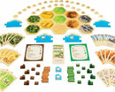 Catan: 5-6 Player Extension game components spread out, featuring hexagonal terrain tiles, resource cards, player pieces in various colors, and building cost cards, designed to accommodate additional players in the popular strategy board game.