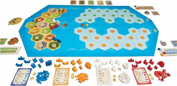 Catan: Explorers & Pirates board game layout showcasing various hexagonal tiles representing land and sea. The game features multiple colors of game pieces: buildings, ships, and resource tokens arranged around the board, along with development cards and game rule cards, creating an immersive strategic gameplay environment.