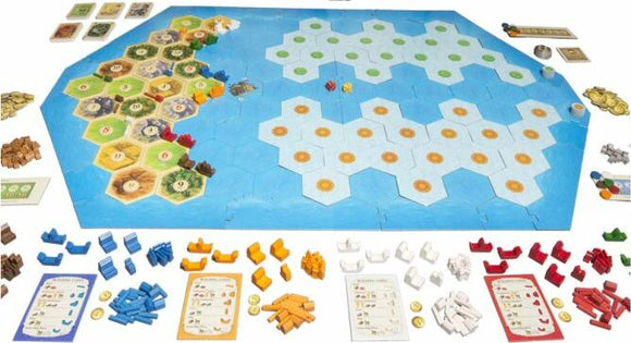 Catan: Explorers & Pirates – 5-6 Player Extension board game displayed on a table. The game features a hexagonal map of islands, resources, and pirate ships, surrounded by various colored game pieces and cards. Ideal for strategic gameplay with family and friends.