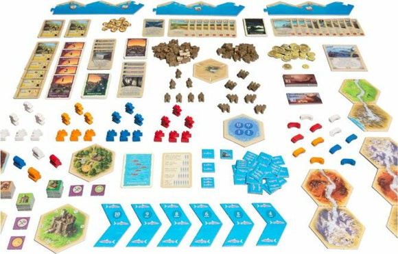A colorful assortment of game components from Catan: Traders & Barbarians, including hexagonal tiles, cards, tokens, and resource pieces, arranged neatly for gameplay. Featuring various colors and shapes representing settlements, roads, and resources, the layout showcases the strategic elements of this popular board game.