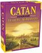 Catan: Traders & Barbarians board game box featuring vibrant artwork of a landscape with rolling hills and a sunset. The top of the box prominently displays the title 'Catan' in large yellow letters, with the subtitle 'Traders & Barbarians' below it. The box is designed to attract board game enthusiasts and features Asmodee branding.