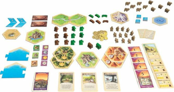 The Catan: Traders & Barbarians extension for 5-6 players features a variety of game components including hexagonal tiles, resource cards, settlement pieces, and coins laid out on a tabletop. The intricate design includes colorful pieces representing resources and player components, enhancing the strategy and gameplay experience.