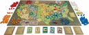 Catan Histories: Settlers of America Trails to Rails board game by Asmodee. The game includes a colorful hexagonal map of the United States, resource cards, and various player pieces in multiple colors arranged around the board.