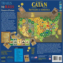 Catan Histories: Settlers of America - Trails to Rails board game. Features a colorful hex-grid map of the United States with various resources and game cards. Includes illustrations of trains, settlements, and resource management elements.