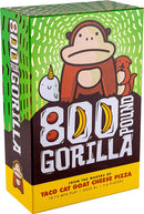 800 Pound Gorilla game box featuring a friendly cartoon gorilla holding a banana, surrounded by colorful characters like a unicorn and an otter. The vibrant green background and bold text attract attention. The game is designed for 3-6 players and offers quick gameplay lasting 10-15 minutes, suitable for ages 8 and up.