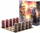 Tactiki game by DRAWLAB GAMES featuring an intricately designed box with vibrant artwork depicting tribal totem figures. The game set includes stacks of uniquely shaped pieces, placed on a board, showcasing numbers and textures, ideal for strategic play with friends.