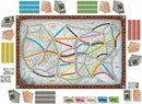 A vibrant game board for Ticket to Ride by Days of Wonder, featuring a detailed map of North America with colorful train routes in various colors. Surrounding the board are train cards, scoring markers, and route cards, indicating the game's strategy and competitive nature.