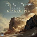 Dune Imperium: Uprising expansion box art featuring a massive sandworm and a barren desert landscape under a dramatic sky. The title is prominently displayed with an artistic design.
