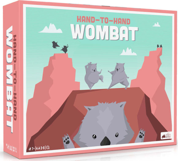 Hand-to-Hand Wombat game by EXPLODING KITTENS featuring whimsical artwork of playful wombats on a colorful mountain landscape. The game box showcases an engaging design ideal for family fun.