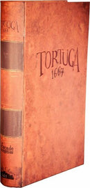 The product image shows the game Tortuga 1667 by Facade Games. The item features a vintage-style book cover with a leather-like texture. The title 'TORTUGA 1667' is embossed prominently on the front, alongside the branding for Facade Games. The spine displays similar details, giving it an authentic, rustic look, suitable for fans of strategy games and immersive tabletop experiences.