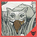 Box cover of the game 'Squirrel or Die' by Atlas Games. The artwork features a large, playful cat with wide eyes, holding a brown squirrel in its mouth, surrounded by tall grass and a whimsical, gray background.