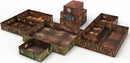 A detailed view of the Tenfold Dungeon: The Town game by Gale Force 9. The game features multiple interconnected buildings, including a clock tower and various rooms, all designed with intricate textures and colors. This modular setup allows for creative gameplay and immersive storytelling.