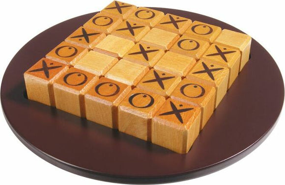 Quixo game by Gigamic displayed on a round brown platform. The game features a wooden grid filled with square blocks marked with Xs and Os, arranged strategically. Ideal for engaging family and friends in a classic tile-based strategy game.