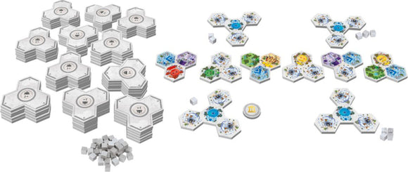 A colorful game set titled 'Akropolis' by Gigamic, featuring numerous hexagonal tiles in various colors and patterns, alongside small cubes. The tiles are arranged in geometric shapes, showcasing an engaging layout for strategic gameplay. Perfect for family game nights or gatherings.