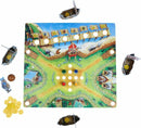 A colorful board game titled 'Valley of the Vikings' by Haba. The game board features a vibrant landscape with paths, various Viking villages, and illustrated boats. Several game pieces, including coins and player tokens, surround the board, which is designed for an engaging gameplay experience.
