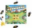 A colorful board game titled 'Valley of the Vikings' by Haba. The game features a vibrant game board depicting a Viking landscape with rivers, mountains, and ships. Surrounding the board are various game pieces including small Viking ships, tokens, and gold coins positioned around the board, suggesting an interactive gameplay experience for family and friends.