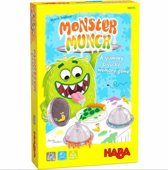 The packaging of the game 'Monster Munch' by Haba features a playful, cartoon-style green monster with a big smile and a long tongue, surrounded by colorful dishes and game elements. The bright yellow box includes the title 'MONSTER MUNCH' prominently displayed along with the tagline 'A yummy & yucky memory game', emphasizing its fun and whimsical theme. Ideal for family game nights.