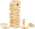 A stacked tower of Jenga blocks made by Hasbro, featuring multiple wooden pieces arranged in a precarious formation with several blocks on the ground nearby, showcasing the game's classic design and challenge.