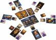 An array of game components from The Resistance: Avalon board game by Indie Boards and Cards. The image displays various character cards, a central game board showcasing different roles, and additional cards spread around, all arranged for play, highlighting the game's strategic social deduction mechanics.