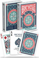 Bicycle Muralis card deck featuring intricate designs in shades of blue, red, and green. The deck includes two visible cards, a King of Diamonds and an Ace of Spades, showcasing the artistic patterns. The box is elegantly designed with 'Bicycle' branding.