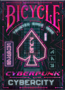 Bicycle Cyberpunk Cybercity playing cards featuring a vibrant, neon-lit design inspired by cyberpunk aesthetics. The packaging showcases a spade symbol and colorful graphic elements, reflecting a futuristic urban vibe. Trusted since 1885, these cards promise high quality and a unique gaming experience.