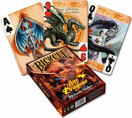 Anne Stokes Age of Dragons playing cards featuring beautifully illustrated designs of dragons and mythical characters. The deck is branded with a vibrant box depicting a dragon. Three cards are displayed showing the Ace of Spades, Nine of Hearts, and Queen of Spades, each showcasing unique art.