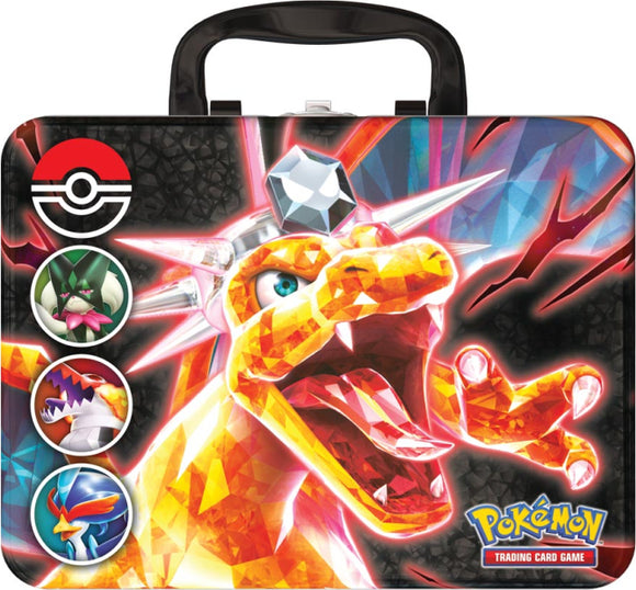 The PKM: Fall Collectors Chest 23 features a bright and colorful design with a fiery Charizard illustration on the front. The chest is adorned with various Pokémon icons including a Poké Ball and images of notable Pokémon characters. It's designed with a durable handle for easy carrying, perfect for storing trading cards and collectibles.