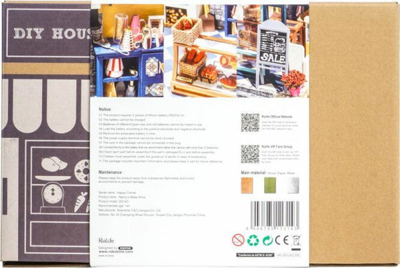 Back view of Nancy's Bake Shop DIY Miniature kit by Robotime showcasing various miniature items including baked goods and decorative elements on shelves. The packaging features clear instructions and maintenance details suitable for miniatures enthusiasts.