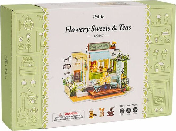 Flowery Sweets & Teas Shop Model Kit by Robotime showcasing a charming DIY miniature shop scene with detailed furniture, signage, and accessories, perfect for creative enthusiasts aged 14 and above.