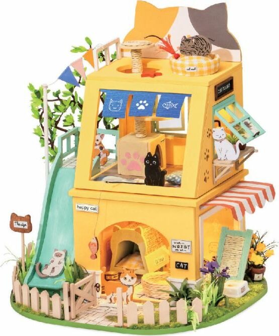 A colorful DIY miniature cat house by Robotime, featuring a whimsical two-story design with a slide, trees, and various cat figurines. The house is adorned with banners, a play area, and flower decorations, inviting creativity and playfulness for cat lovers.