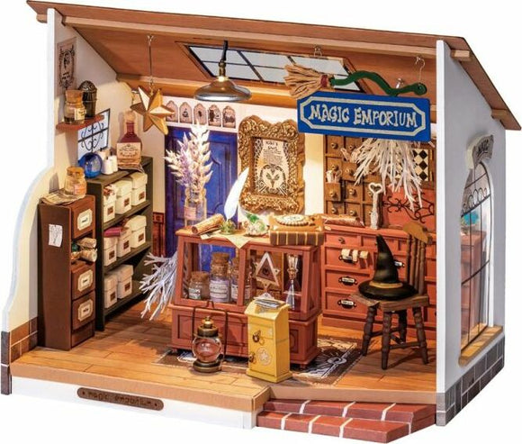 Kiki's Magic Emporium DIY kit by Robotime, featuring an intricately detailed miniature shop with shelves of magical ingredients, a workbench, and decorative items like a broom and potion bottles, all set in a cozy, inviting room.