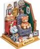 A charming DIY Holiday Living Room kit by Robotime features a cozy scene with a teddy bear in a chair, festive decor, and various tiny furniture pieces. Perfect for crafting enthusiasts to create a delightful miniature holiday display.