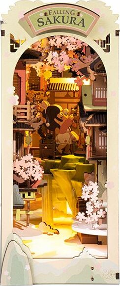 A beautifully crafted DIY Book Nook model titled 'Falling Sakura' showcasing a vibrant scene with falling cherry blossoms, quaint buildings, and figures enjoying a serene environment. The intricate details bring life to the enchanting atmosphere, perfect for displaying on shelves or as a charming decor piece.