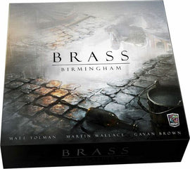Brass: Birmingham board game box by Roxley Games featuring an artistic design. The box shows cobblestones and historical elements, with the title 'BRASS' prominently displayed. The names of the creators Matt Tolman, Martin Wallace, and Gavan Brown are featured at the bottom.