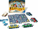 The Labyrinth Team Edition game by Ravensburger features a colorful game board filled with a maze of paths, tiles, and various game pieces. Players work in teams to navigate the labyrinth and collect treasures, accompanied by cards and other game components displayed beside the game board and box. The vibrant artwork and interactive gameplay make it a fun choice for family game nights.