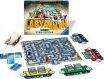 Labyrinth Team Edition board game by Ravensburger. The game features a colorful game board with a maze design, various game pieces, and cards. The box cover is prominently displayed, emphasizing the game's exciting theme.