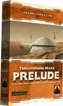 The box of Terraforming Mars: Prelude, a strategy board game by Stronghold Games. The cover features a futuristic Martian landscape with a habitat dome and various structures, highlighted with the title 'Prelude' prominently displayed in bold letters. The overall design reflects themes of space exploration and corporate strategy.