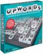 The Upwords game by Hasbro, featuring a colorful teal box design. The box displays the game's name prominently on the front along with letters and a game board layout, inviting players to stack words creatively. A sticker indicates it includes a new scoring feature for added fun.