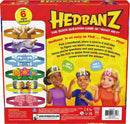 Hedbanz 2nd Edition game box by Spinmaster showcasing the colorful design. The back of the box features instructions, character illustrations, and headbands for players to wear, engaging in a guessing game. Players use clues to identify what’s on their cards, making it a fun activity for family and friends.