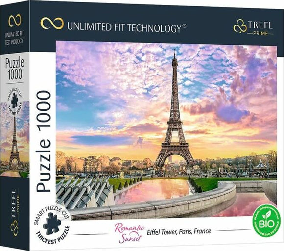 A jigsaw puzzle box featuring a picturesque sunset view of the Eiffel Tower in Paris. The sky is painted in vibrant hues of pink, orange, and purple, reflecting off the tranquil waters in the foreground. The box displays 'Romantic Sunset' and details that it's a 1000-piece puzzle using Trefl's smart puzzle cut technology.