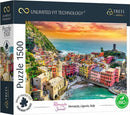 Trefl Romantic Sunset Vernazza jigsaw puzzle featuring a stunning coastal view of Vernazza, Liguria, Italy, during sunset. The puzzle has 1500 pieces and showcases colorful buildings along the shore, surrounded by greenery and water, highlighting the natural beauty of the Italian landscape.