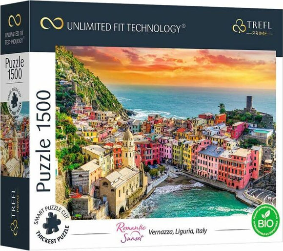 Trefl Romantic Sunset Vernazza jigsaw puzzle featuring a stunning coastal view of Vernazza, Liguria, Italy, during sunset. The puzzle has 1500 pieces and showcases colorful buildings along the shore, surrounded by greenery and water, highlighting the natural beauty of the Italian landscape.